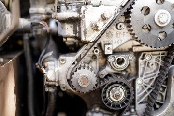 Detailed image of a car engine's internal workings, showcasing the timing belt and gears.