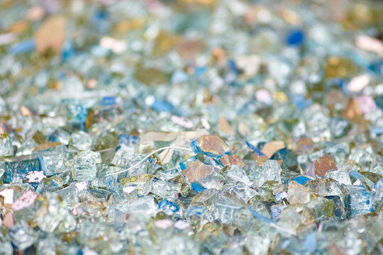 Multicolored glass fragments collection for mosaic art creation and craft projects. DIY upcycling materials and artistic recycling concept. Creative reuse of broken glass for handmade artwork.