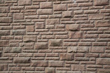 Patterned rectangular cut natural stone wall