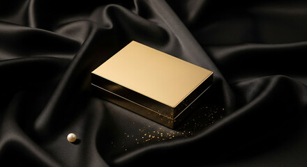 Gold box on black silk fabric