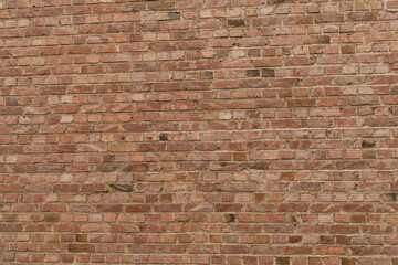 High-resolution image of a red brick wall, perfect for backgrounds and textures.