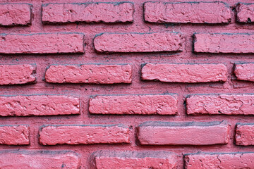Horizontal pink red brick wall with rustic pattern, visible mortar lines, and subtle rough texture. Ideal abstract background for vintage, classic and design themes.