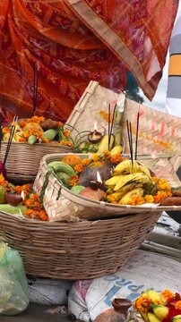 Chhath Pooja dala or basket having banana, sindoor, diya and other items for offering it to God Sun at Chath ghat. vertical video
