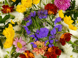 Flower arrangement of summer decorative garden flowers, top view. Gifts of nature, floral background.