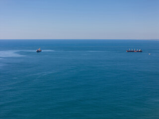 Cargo vessel ship at blue sea