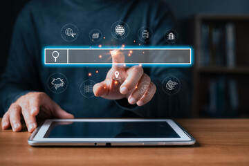 A person uses a tablet with a glowing virtual search bar surrounded by digital icons symbolizing internet,engine,cloud,data,AI,location,and security,highlighting modern search engine technology.