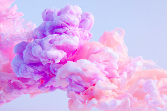 An ethereal abstract image of pastel purple ink tendrils suspended in water