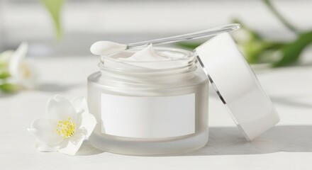 Luxury face cream jar with spatula and jasmine flower showcasing a clean beauty product perfect for skincare and cosmetic advertising