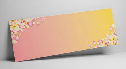 Pastel pink and yellow gradient background featuring delicate pink and yellow flower petals perfect for spring wedding invitations