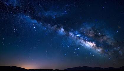 Fototapeta premium A starry night sky with bright stars, clouds, and a faint nebula, illuminating the dark universe