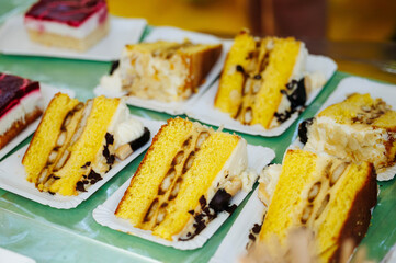 Variety of delicious cake slices on display for dessert lovers