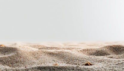 Close-up of light beige sand, gently rippled