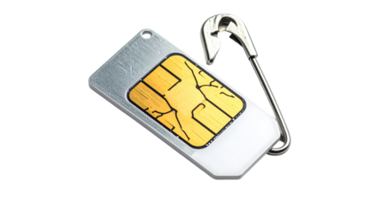 Broken SIM card attached to a safety pin
