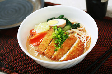 thai noodle soup with fried pork chop and eeg