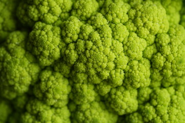 macro Green cauliflower texture close-up – vegetable pattern background top view 