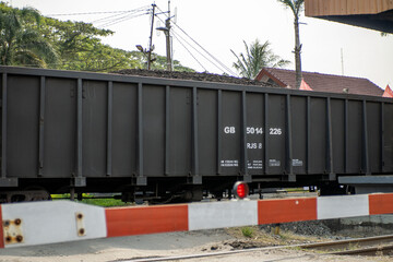 Photo of a train carriage transporting coal. Coal train carriage.
