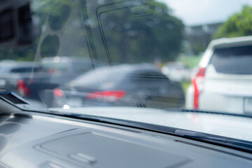 Obraz premium Car windshield console,Blurred center console and windshield,Blurred raining view from inside the car console.