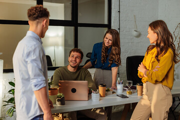 Coworkers discussing new project during meeting in modern office