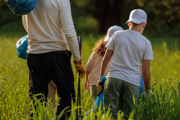 Volunteers cleaning meadow from plastic waste pollution
