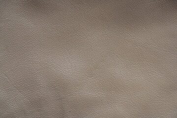 beige leather texture close-up, seams on leather jacket as background, beige natural leather as background, light brown leather stitching	

