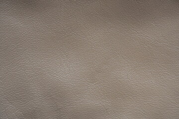 Fototapeta premium beige leather texture close-up, seams on leather jacket as background, beige natural leather as background, light brown leather stitching 