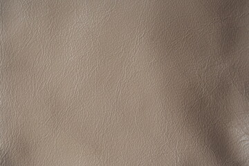 Fototapeta premium beige leather texture close-up, seams on leather jacket as background, beige natural leather as background, light brown leather stitching 