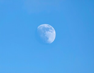 Moon in Daytime Blue Sky