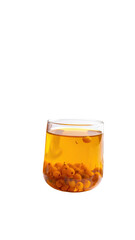 Transparent glass cup filled with amber liquid and seeds