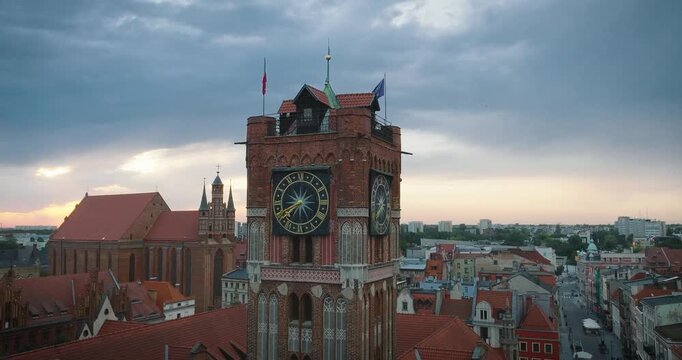 Aerial Orbit of Toruń's Town Hall at Golden Hour