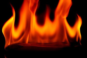 Vibrant Flames Dance in a Dark Background Creating Intense Heat