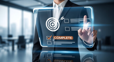 Business professional in modern office interacting with futuristic digital interface showing target and checklist with complete status for innovative technology solutions