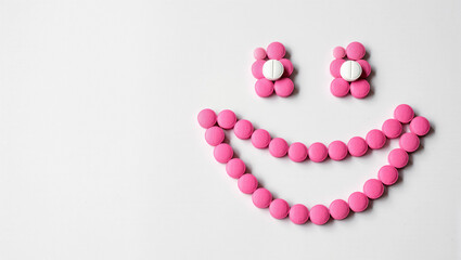 Creative arrangement of colorful pills forming a cheerful smiley face