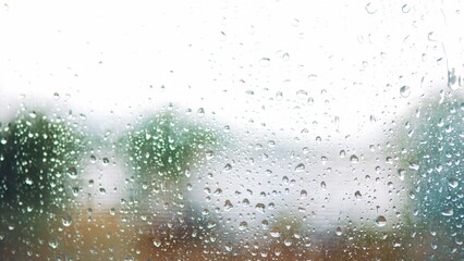 raindrop on the window in autumn a background. wet glass rain drops rainy sky blurred background close-up. rain in the window on the background of lifestyle the sky blurred plan