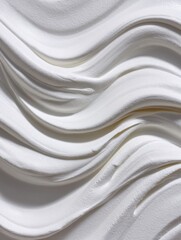 Obraz premium A close-up of an elegant white gessoed canvas surface with undulating waves, creating an abstract, minimalist texture. Ideal for backgrounds, art, and design projects.