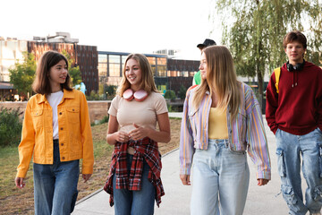 Fototapeta premium Group of teenagers walking on city street