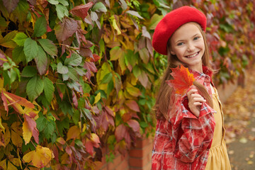 smiling girl in red beret