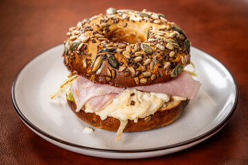 Bagel sandwich with ham and scrambled eggs