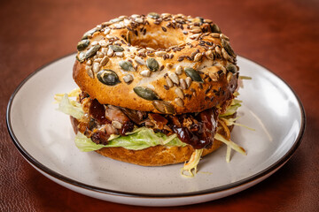 Bagel sandwich with barbecue pork and lettuce