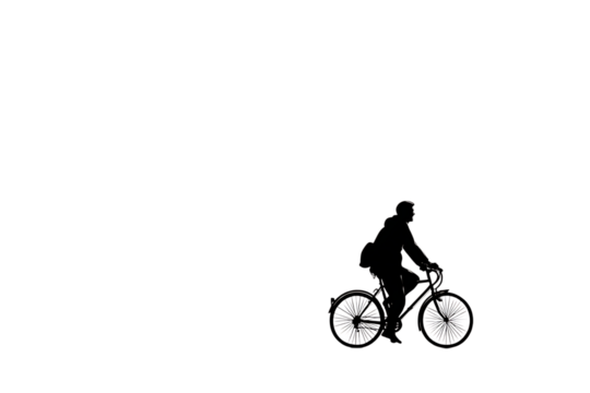 Confident cyclist with backpack pedals energetically, embracing freedom and an active lifestyle during an outdoor journey