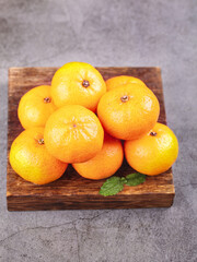 Fresh Harvested Tangerines from Guangxi Sihui China on Wooden Board