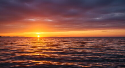 Fototapeta premium Sunset over calm water