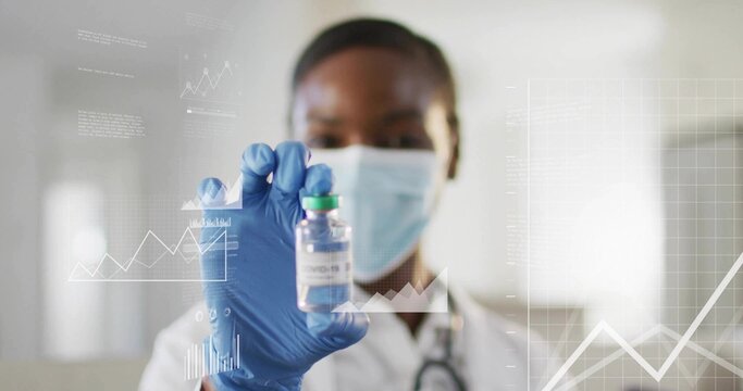 Holding researcher wearing mask and gloves analyzing chart data in hospital lab, with COVID-19 vial - Powered by Adobe