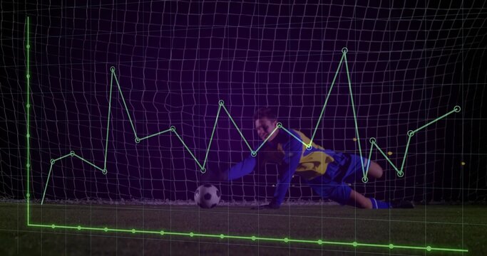 Saving focused goalkeeper diving low on stadium pitch at night, with overlaid green data graph - Powered by Adobe