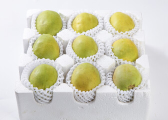 Fresh Green Papayas in Protective Packaging Box Ready for Shipping