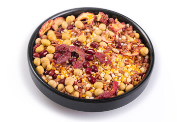 Assorted grains beans nuts and dried fruits mix in black bowl for healthy nutrition and plant-based diet ingredients