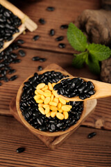 Black Soybean and Corn Grain Ingredients in Wooden Bowl on Rustic Wood Background with Fresh Mint
