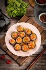 Stuffed Shiitake Mushrooms with Vermicelli Noodles and Garlic on Wooden Table
