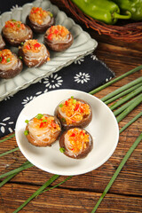 Stuffed Shiitake Mushrooms with Vermicelli Noodles and Mixed Vegetables on Wooden Table