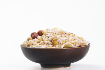 Mixed nuts grains legumes peanut soybean healthy snack bowl white background