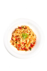 Spicy Asian stir-fried rice noodles with peppers and vegetables on white plate